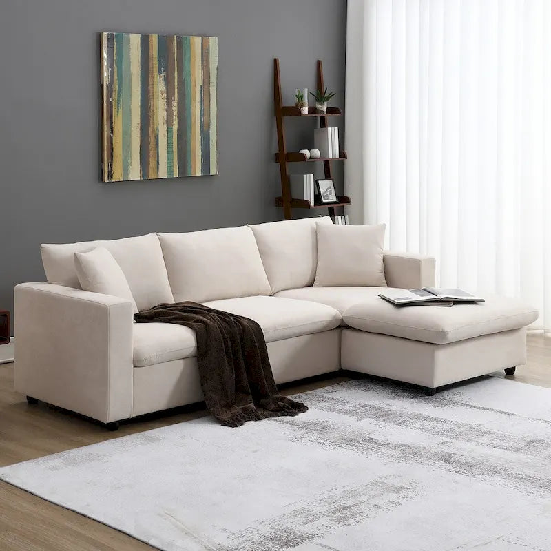 Divano componibile a L reversibile beige con pouf, 4 posti